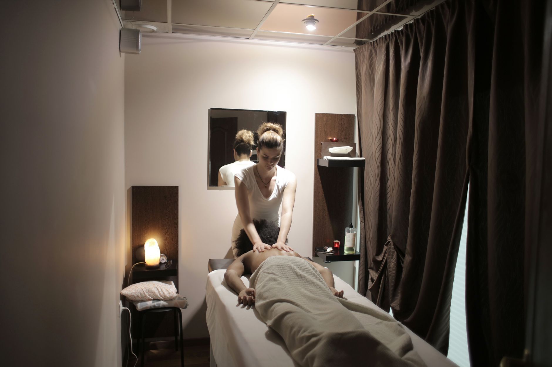 Registered massage therapist with a client