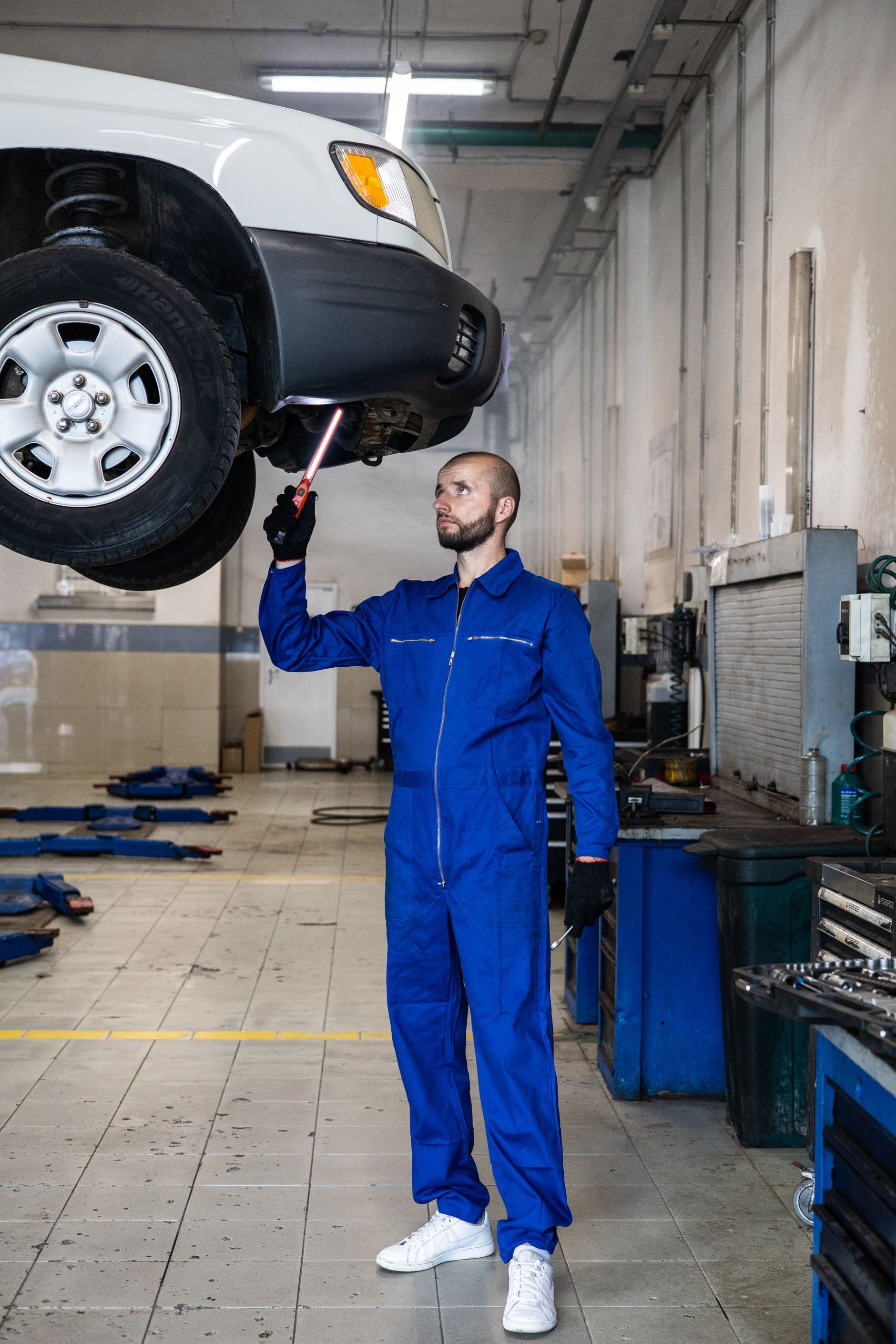 Mechanic working under a vehicle