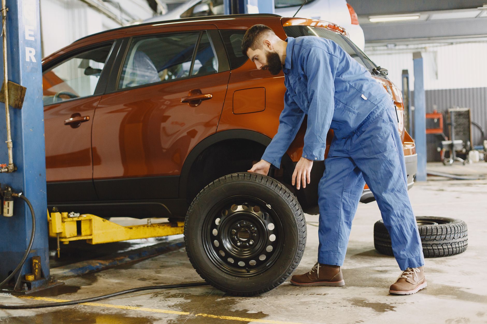 Checking a tire on an SUV