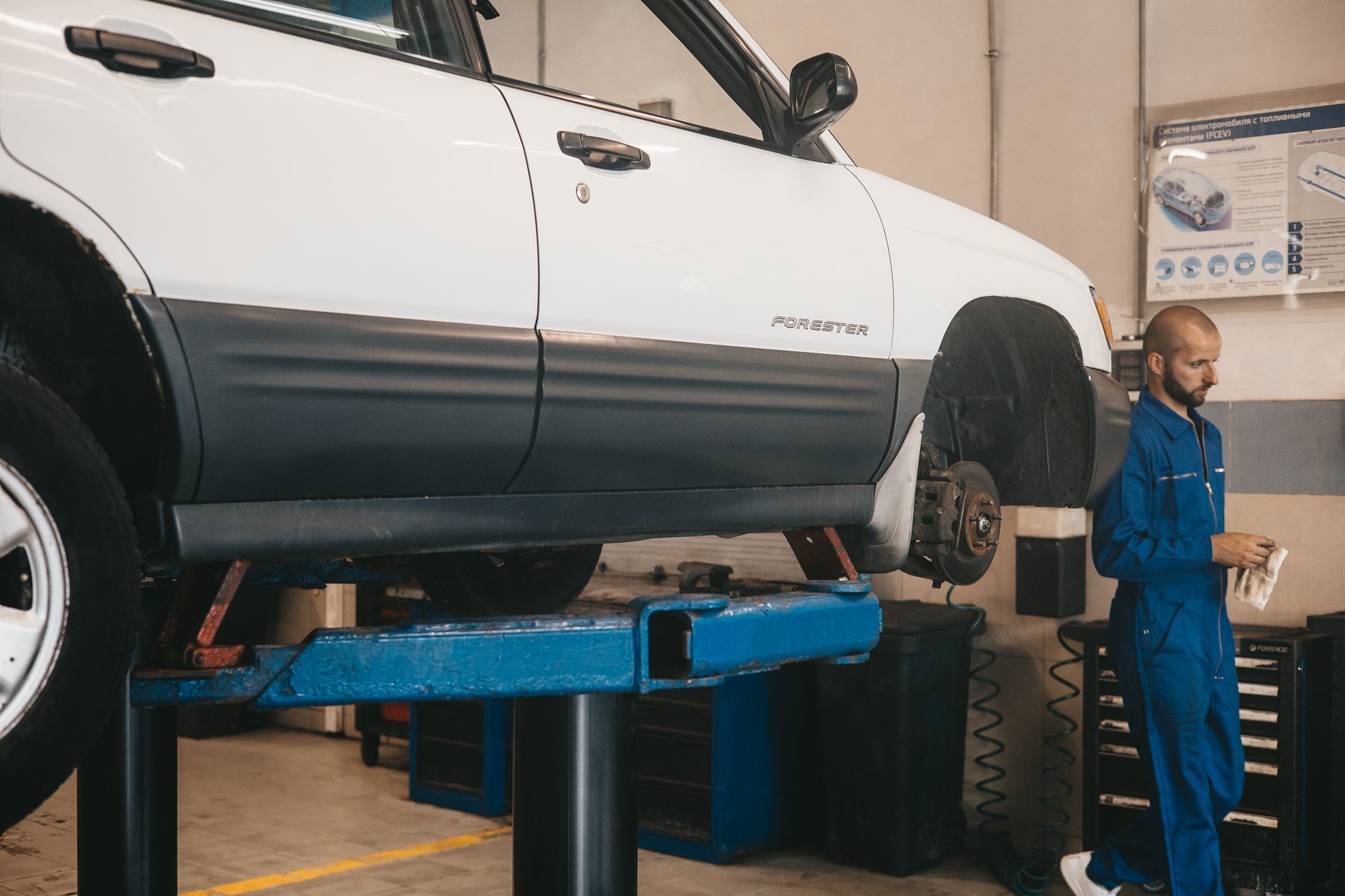 Car on a lift in the service bay