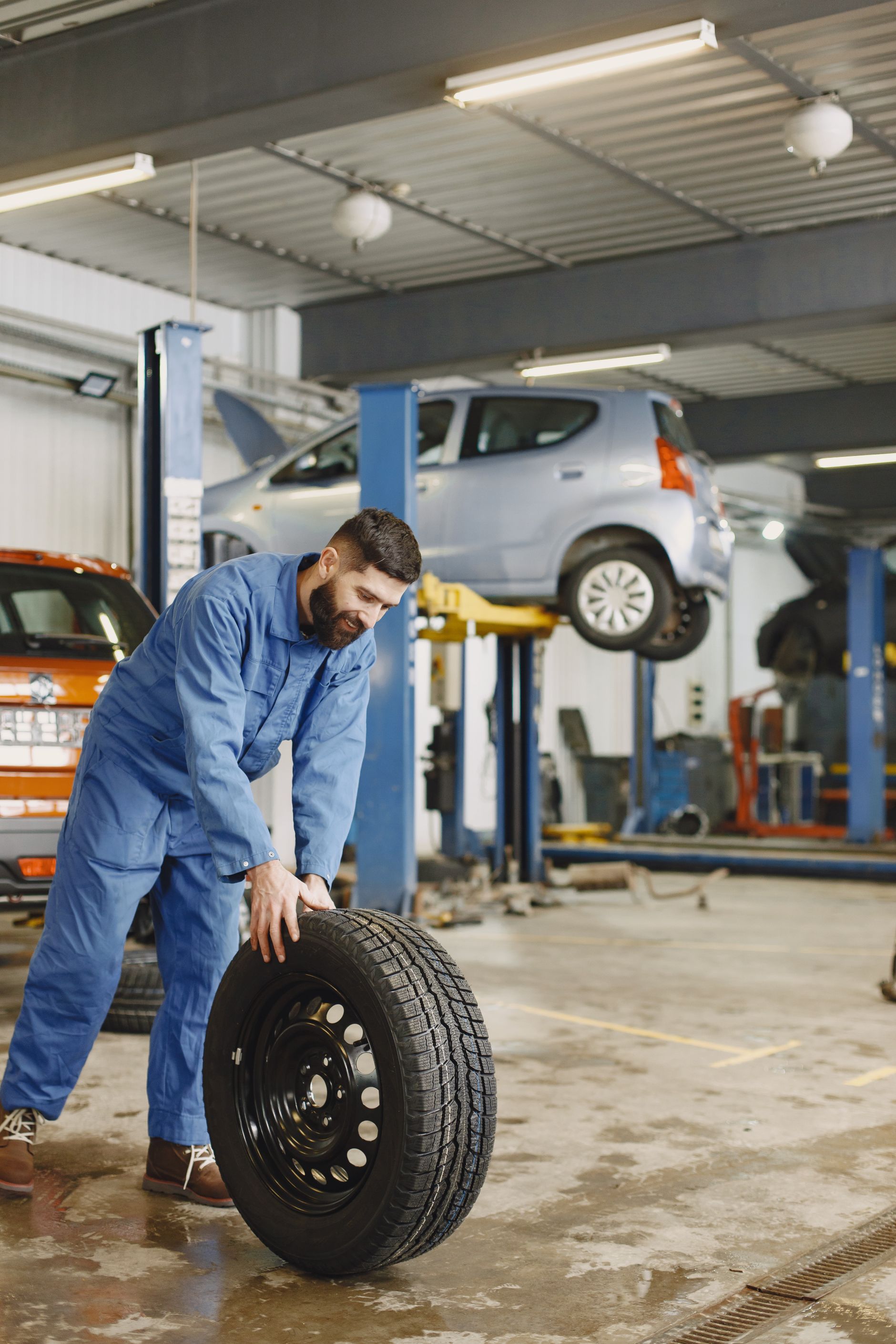 Mechanic with a new tire